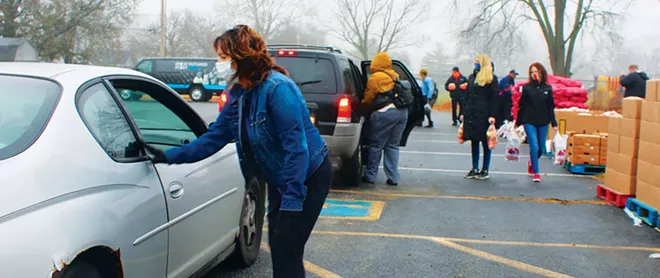 A Dec. 10 holiday food giveaway at Boys & Girls Clubs of Central Illinois was the last one planned, as a federal grant funding source has ended. - PHOTO BY STACIE LEWIS