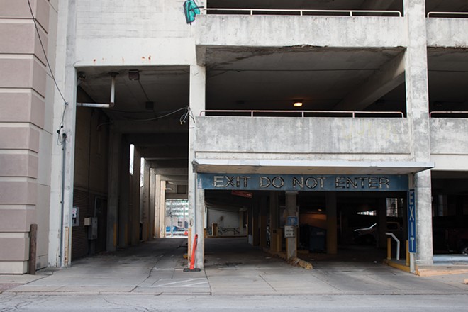 The city has gotten bids to demolish the dilapidated parking garage at Fourth and Washington streets. While plans for a new hotel are off the table, UIS has expressed interest in a downtown campus. - PHOTO BY STACIE LEWIS