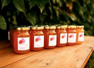 A personalized honey jar design from Big Delicious Planet that was used as a wedding favor. - PHOTO BY EMILY MELISSA PHOTOGRAPHY