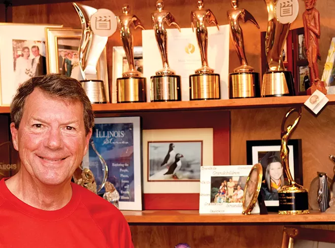 McDonald with some of the awards he has won during his broadcasting career, many of them for the "Illinois Stories" program. - PHOTO BY DAVID BLANCHETTE
