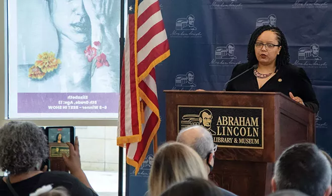 Christina Shutt, director of the Abraham Lincoln Presidential Library and Museum, introducing the winners of a student art contest held in cooperation with the State Board of Education. - PHOTO COURTESY ALPLM