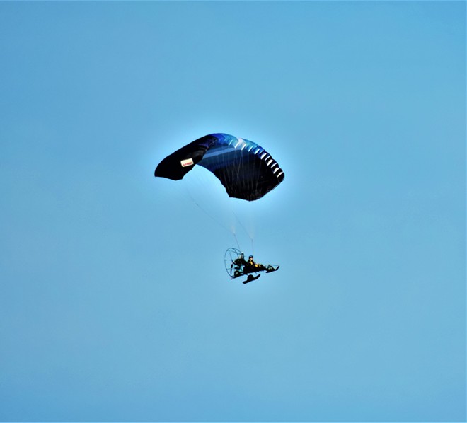 A paraglider coming from the vicinity of Moscow Mountain to near Nora Creek.