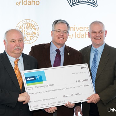 From left: Fred Pollard, University of Idaho resource conservation manager, UI President Chuck Staben and Avista Director of Energy Efficiency Dan Johnson hold a check for $1,044,365 that was presented to UI Monday, Feb. 13, 2017, at UI following the completion of an energy efficiency project. The project, completed over the fall semester, was to count and replace 66,815 fluorescent lights with T-8 LED bulbs in more than 85 buildings on the Moscow campus and at UI facilities in Post Falls and Coeur d&#146;Alene. The project will yield savings of more than $355,000 annually. Photo by Melissa Hartley/University of Idaho