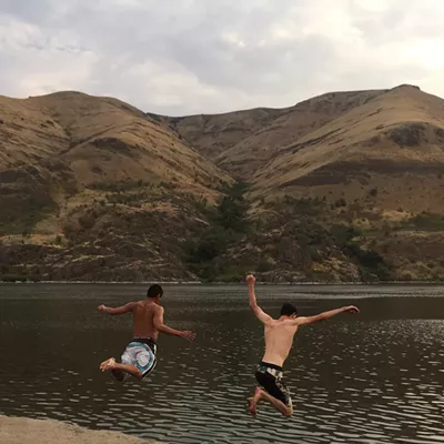 Wakiyan Price and Joshua Johnson beat the heat by jumping into the Snake River August 9.