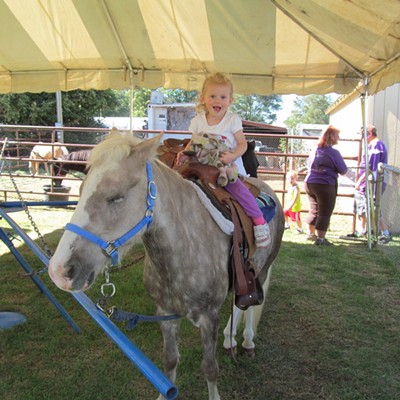 First Time Horse Rider- Raelynn Polumsky, 2, of Lewiston was very excited to ride her first horse at the fiar. Brandi Polumsky of Lewiston took the snapshot in September
