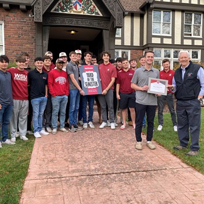 November 5, 2023 - As chapter members look on, Beta Theta Pi live-in advisor Jayden Patterson receives the Fraternity Yard of the Semester award presented by Pullman Mayor Glenn Johnson on behalf of the College Hill Association and the City of Pullman. The chapter is located at 820 NE Linden St. in Pullman.