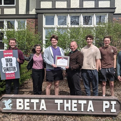 Beta Theta Pi is recognized as the Fraternity Yard of the Semester April 21. On behalf of the College Hill Association and the City of Pullman, Mayor Francis Benjamin presents the award certificate to Chapter President Quinn Stauffacher while Live-In Adviser Jayden Patterson, holding the sign, Allison Munch-Rotolo of the College Hill Association, and chapter residents look on. The chapter is at 820 NE Linden Street in Pullman.