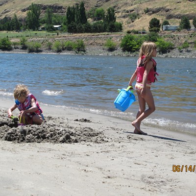 Sisters, Maya, 7 and Sage, 4, enjoying the day at Red Bird Beach. Parents are David and Donna Pankey of Lewiston. Grandma Lois Pankey snapped the picture, June 14, 2015