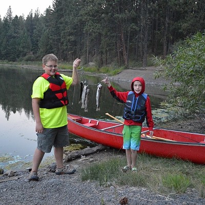 Photo taken August 16, 2015, by Terri Elsberry.
    
    Silas Elsberry (Parents Russell and Terri Elsberry)
    Conner Short (Parents Jesse and Jen Short)
    
    Silas Elsberry and Conner Short, both age 11 of Lewiston, Idaho, caught these Rainbow Trout fish while canoeing and camping at Winchester State Park this last weekend. There was enough fish for camp dinner, and they were delicious.