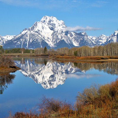 A beautiful setting of the Grand Tetons and reflection in the water. Taken May 15, 2021.