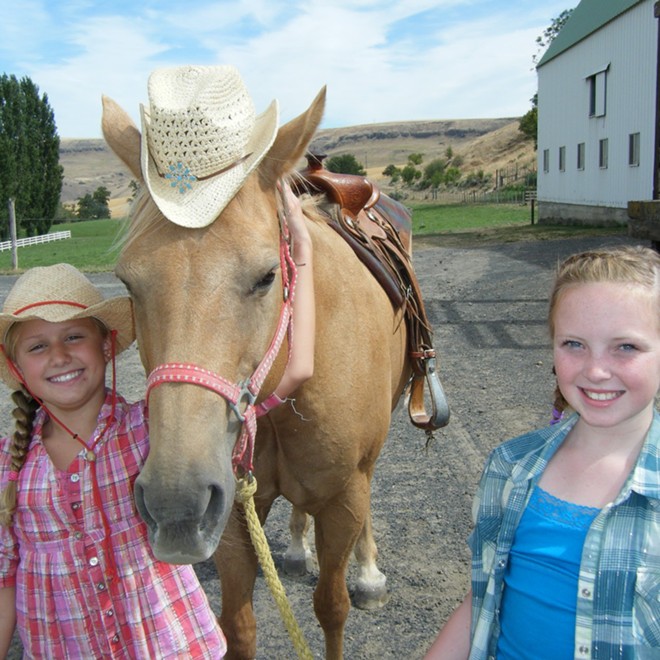 Horsing around in style. Ashley Dominy and Camille Teats of Lewiston.