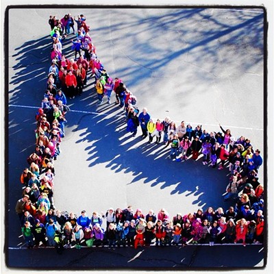 Russell Elementary School in Moscow, led by 3rd grade teacher Mary Karin Miller, kicked off Idaho Day with an all-school picture. The students formed the outline of the state and teachers and staff formed a heart in the middle near where Moscow is on the map. Photo Credit: Craig Allen, Principal
    3/4/15