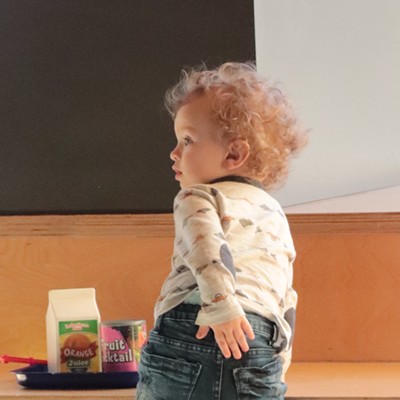 "Uh oh! Something might be going on back there." Owen, 1, enjoying a snack at the Lewiston Library with his mom, Kayla Thomasson.
    
    Photo taken March 18, 2019
    Lewiston library, Lewiston
    Photo by Nan Vance