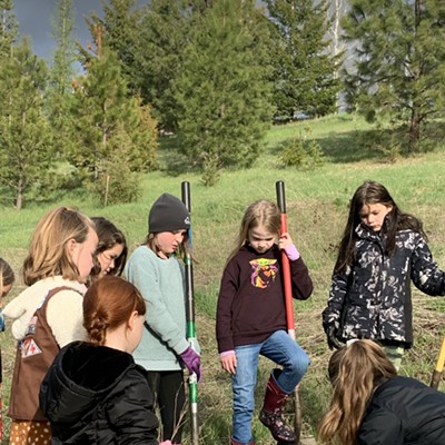 Girl Scout troop 2005 works with PCEI staff Abby Castle to plant trees to fulfill their Tree Promise