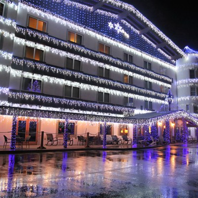 Christmas Lights still on in Leavenworth, Washington and reflecting off the wet parking lot pavement of a local downtown hotel. Picture taken by Keith Collins on February 7, 2020