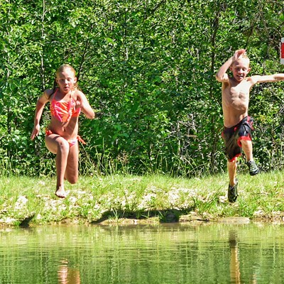 07/19/15 Photo taken at "Hagen Pond" just outside of Fernwood, ID. Alea (left, age 10) and Brady (age 9), both of Lewiston, make the jump into their grandpa Gail's pond to cool off on a hot July day. Parents are Max and Julee Moore. (Lewiston) Photo by Max Moore.