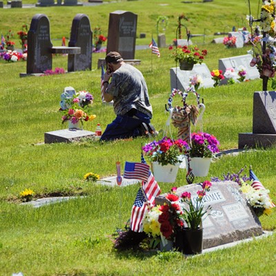 We visited the Vineland Cemetary in Clarkston and saw this man placing flowers at his mother in law's grave on Memorial Day. Taken by Mary Hayward of Clarkston May 29, 2017.