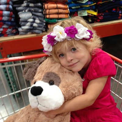 Sage Pankey, 4, cuddles the doggie hoping her Mom will buy it for her.  David and Donna Pankey of Lewiston are the parents.  The photo was taken at Costco October 9th by Donna Pankey