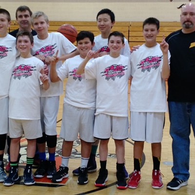 The Moscow Lightning celebrates its championship in the AAU 7th-grade boys division of the Battle Basketball Tournament Jan. 1-3 in Asotin. The Lightning went 4-0 in the tournament, beating the Lewiston Fury, Lewiston Pride, Clarkston Force and the Asotin Storm. Players, left to right, are Joe Colter, Brandon Suquet, Benny Kitchel, Isaac Staszkow, Mark Hong, Riley Vogt and Kel Larson. Not pictured is Tyler Skinner. Coaches are Alan Kitchel, left, and Erick Larson.