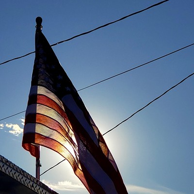 The American Flag softly waves in the late afternoon sunlight as it sits atop Clarkston Fire Engine 81 before beginning it's travel through the LC Valley for the 9/11 procession.
    
    Date Taken: 9/11/19
    Where: Main Street, Asotin
    Photographer: Brook Brown