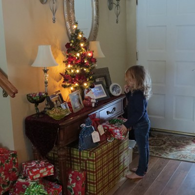 Three-year-old Piper Wilson peruses the pictures on a digital photo frame. The snapshot was taken Christmas Day at "Papa Stewart's" home in Orofino - grandma Le Ann Wilson was behind the lens. Piper is the daughter of Jill and Josh Wilson of Houston, Texas.