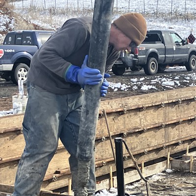 Drew Clark of Top Shelf Concrete places concrete in a monolithic pour on March 24, 2023. This is the foundation for the second house to be built in Moscow by students in the College of Art and Architecture at the University of Idaho. This two bedroom affordable home will be constructed this summer and sold later in 2023 by Moscow Affordable Housing Trust.