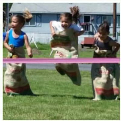 Skylin Parrish, 8, competes in the sack race June 27 on the last day of school at&nbsp;Lapwai Elementary. &nbsp;Photo by grandmother Lori Picard.