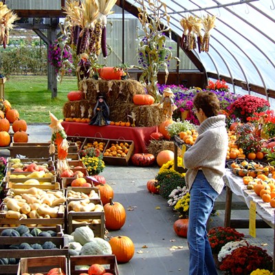 My wife Frances checking out the goodies at this farmers market in Connecticut on 10/2009.   By Jerry Cunnington.