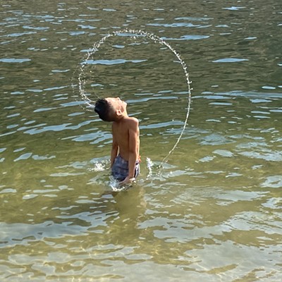 Jarrett Rowden soaking up summer fun while his sister Zora takes pictures.