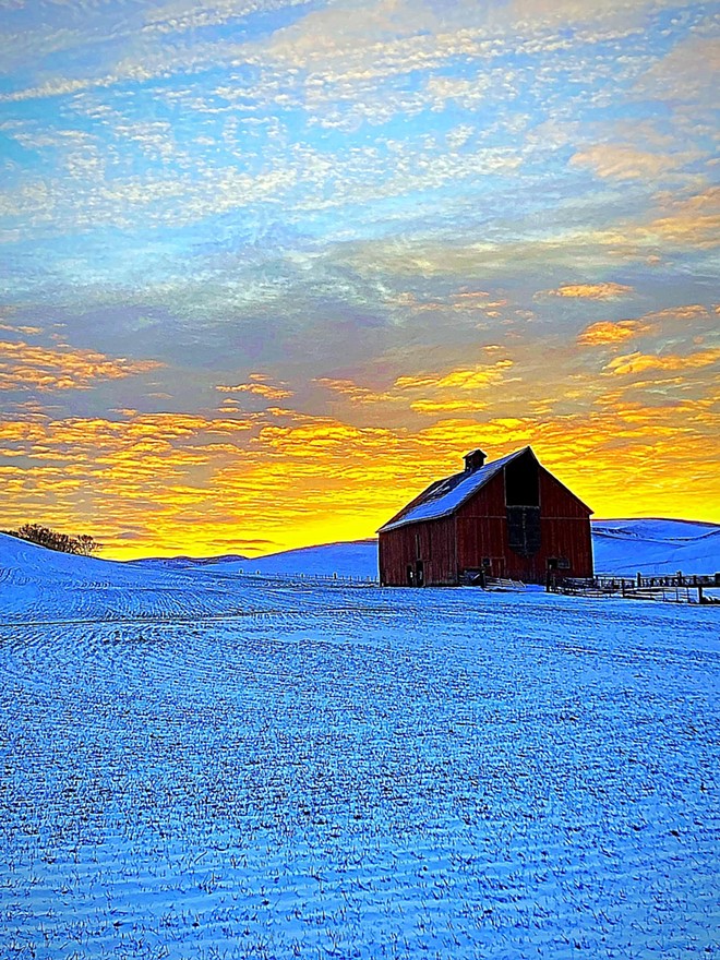 Sunset behind barn