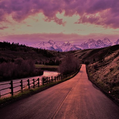 A filtered sunset over the Grand Tetons and a rural road. Taken May 15, 2021.