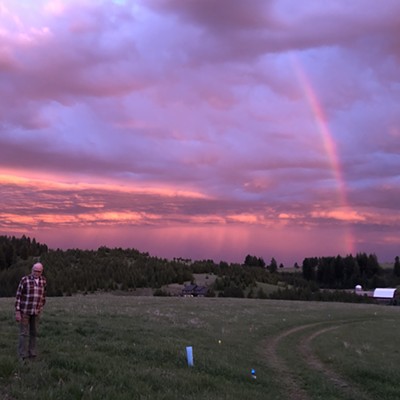 After the storm and a beautiful sunset, this rainbow appeared in the southwest sky. David Purtee, 78, stands in his field on Wallen Road to admire the glorious colors. Picture by wife Karen Purtee, 29 April 2020.