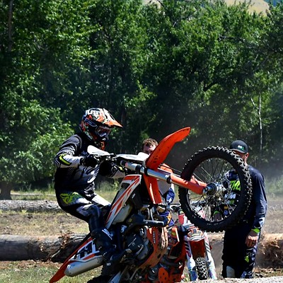 Bryan Witt conquers an obstacle in July .