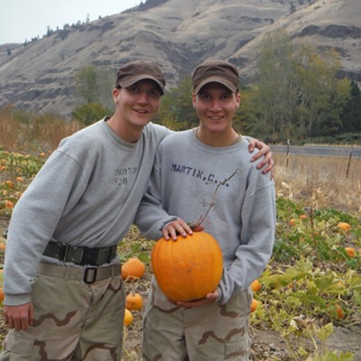 The 17-year-old Martin twins, Chandler, left, and Conner, of Kuna are cadets at the Idaho Youth Challenge Academy in Pierce. They were photographed Oct. 24 by Nico Pinque at Gibbs Fruit Stand on Highway 12 where they were choosing jack-o-lanterns after participating in work detail in Lewiston.&nbsp;Cadets visit the valley occasionally on Fridays and Saturdays to conduct 'Service to the Community' projects.