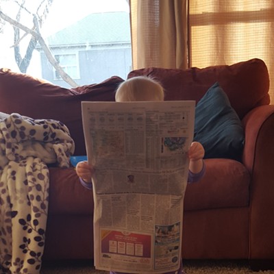 Addison Merrill, 15 months,&nbsp; starts her morning by reading the Lewiston Tribune before her day gets into full swing. Addison is the&nbsp;daughter of Dane and Andrea Merrill of Lewiston.&nbsp;Photo was taken February 15 at home by her aunt, Britt Merrill.