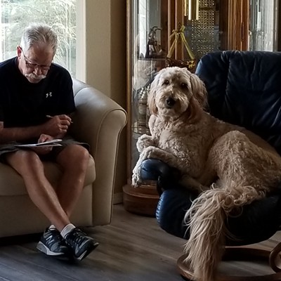 Every morning Doug and Cooper work the Lewiston Morning Tribune crossword puzzle together. It's their morning job.