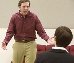 Man, left, played by Brian Linnenkamp, yells at Woman, played by Chelsea Gilpin, during rehearsal for the Washington State University drama production of "The Treatment" in a Daggy Hall classroom on Jan. 30 in Pullman. The show will play in Wadleigh Theatre in Daggy Hall. 'Man' is an Iraq War veteran suffering from post-traumatic stress disorder and flashbacks after being a guard and interrogator at Abu Ghraib prison while 'Woman' is his Army psychologist trying to help him get over his experiences. - DEAN HARE