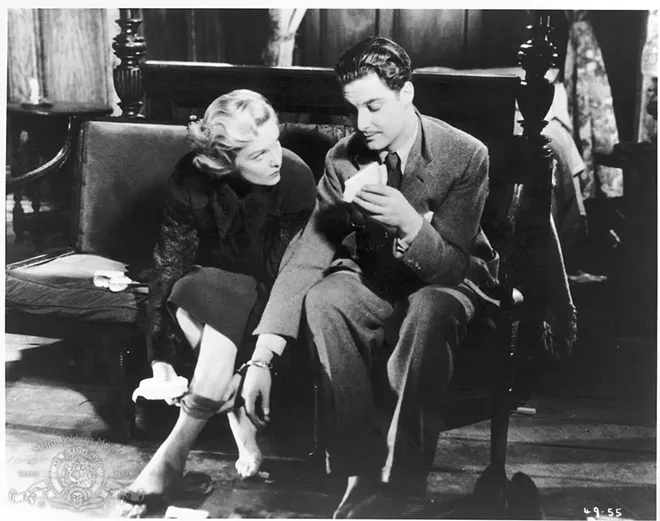 Stars Robert Donat and Madeleine Carroll are handcuffed together for many scenes like this one in Alfred Hitchcock’s “The 39 Steps.”