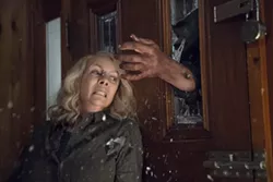 This image released by Universal Pictures shows Jamie Lee Curtis in a scene from "Halloween." (Ryan Green/Universal Pictures via AP) - RYAN GREEN/UNIVERSAL PICTURES VIA AP