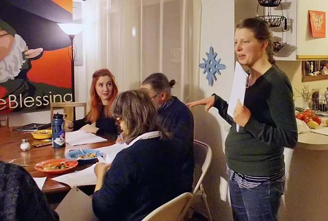 Director Rebecca Haley talks to cast members of Moscow Community Theatre's upcoming show, "The Man Who Came to Dinner", at the group's first read through at Haley's home December 13. , - KAI EISELEIN/DAILY NEWS