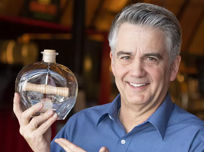 Geoff Crimmins/For Inland 360 Brad Byers one of his impossible bottles on Tuesday in Pullman. Byers has made more than 200 of the bottles in a little over a year. - GEOFF CRIMMINS/FOR INLAND 360