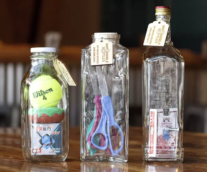 Brad Byers of Pullman creates impossible bottles, which contain objects that don't fit through the mouth of the bottle. - GEOFF CRIMMINS/FOR INLAND 360