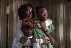 This image released by Universal Pictures shows, from left, Evan Alex, Lupita Nyong'o and Shahadi Wright Joseph in a scene from "Us," written, produced and directed by Jordan Peele. (Claudette Barius/Universal Pictures via AP) - CLAUDETTE BARIUS/UNIVERSAL PICTURES VIA AP