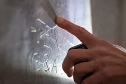 Documenting marks found inside a railroad depot from the many hoboes who passed through. Photo by Charlie Wray