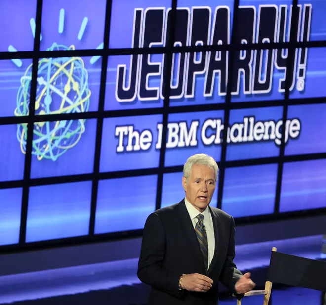 FILE - In this Jan. 13, 2011 file photo, Alex Trebek, host of the "Jeopardy!" quiz show, speaks to an audience of primarily media about an upcoming "Jeopardy!" show featuring an IBM computer called "Watson" in Yorktown Heights, N.Y. Canadian "Jeopardy!" host Trebek has announced that he has stage 4 pancreatic cancer. In a note and video released Wednesday, March 6, 2019, the long-time game show host said he plans to fight the diagnosis, joking that he still has several years left on his contract. - AP PHOTO/SETH WENIG, FILE