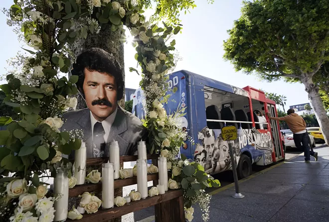 A shrine to the late "Jeopardy" quiz show host Alex Trebek is pictured near his star on the Hollywood Walk of Fame, Monday, Nov. 9, 2020, in Los Angeles. Trebek died of pancreatic cancer Sunday at age 80. - AP PHOTO/CHRIS PIZZELLO