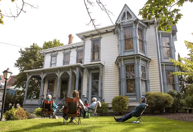 Members of Lula's Library book group listen while Steve Talbott talks about homesteading on Wednesday, Sept. 23, outside McConnell Mansion in Moscow. The group is reading "Four Girls On A Homestead," by Carol Ryrie Brink. Geoff Crimmins/Moscow-Pullman Daily News - GEOFF CRIMMINS/DAILY NEWS