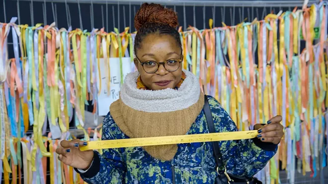 A woman displays her ribbon in this photo taken from the www.theclimateribbon.org website. Local people can create their own during an event planned for Saturday in Moscow.