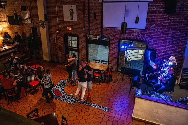 Patrons at Brock’s dance while Sherry and Marty Lukenbill perform on Friday, April 23, in downtown Lewiston. - PETE CASTER/360