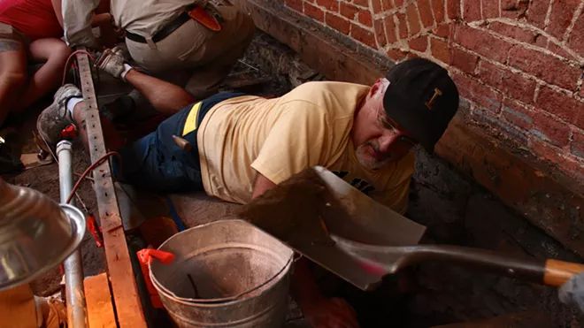 Mark Warner, professor of anthropology at University of Idaho, excavates a well unexpectedly discovered at the Cyrus Jacobs-Uberuaga Boarding House in Boise. - MARK WARNER